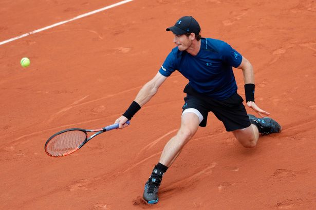 Britains-Andy-Murray-returns-the-ball-t