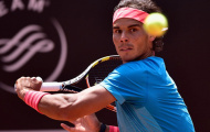 Nadal hóa giải cú giao bóng của Isner