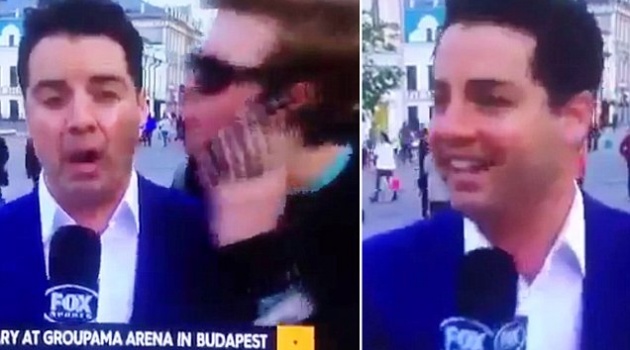 Fan cuồng cưỡng hôn phóng viên World Cup